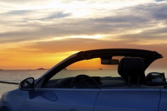 Ibiza cala Conta Conmte sunset in convertible car