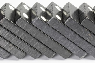 Composition of lying black domino bricks with white dots