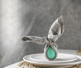 Food, Food, Festive Easter table setting. Funny Easter bunny made of green egg and linen napkin on