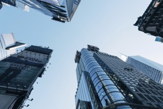 New York City, USA, June 25, 2018: Low angle view of skyscrapers in Times Square in Midtown, North