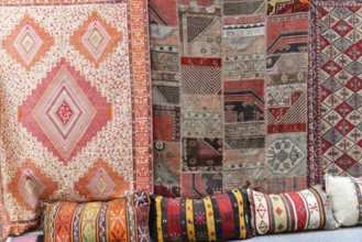 Grand Bazaar, Istanbul, Turkey, Asia, Various traditional carpets and colourful cushions with