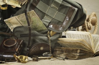 Still life with an old backpack and travel accessories