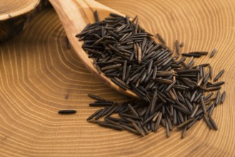 Wild rice on wooden spooon