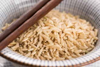 Raw brown rice in a bowl