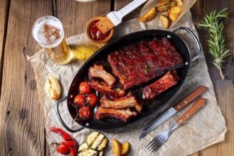 Grilled ribs in a spicy marinade with salad and vegetables