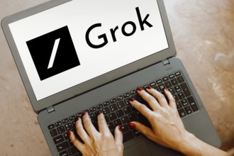 In this photo illustration, the xAI Grok logo is displayed on a notebook screen