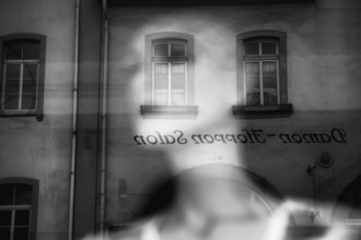 Reflection in a windowpane, women's fashion, Bad Karlshafen, Weser Uplands, Weserbergland, Hesse,