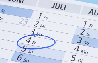 Photo shows a calendar with a pin marking the 4th of July