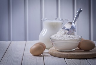 Eggs piala with flour and milk in jug