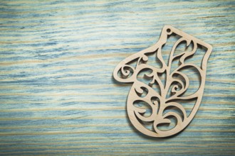 Vintage wooden mitten on wood board holidays concept