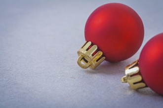 Red christmas balls on gray background with copyspace