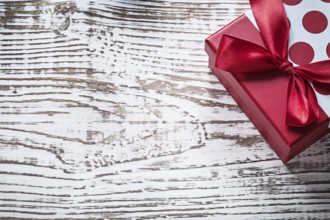 Packed present box on vintage wooden board copy space holidays concept