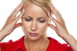 A pensive young blonde woman with a headache and migraine, 25, 30, years Studio shot, Federal