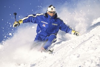 Skiers in action, deep snow, Austria, Europe