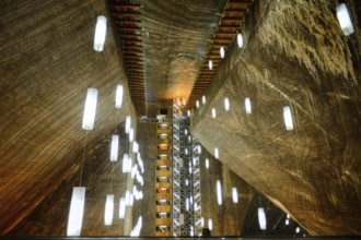 A look inside the historic Salina Turda salt mine with lights in Romania