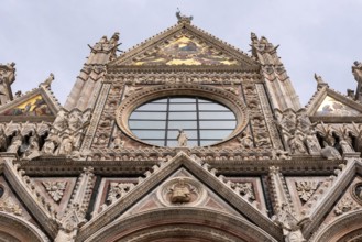 Great gothic portal of the Siena Cathedral in Italy