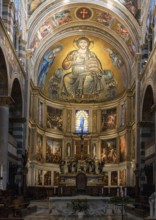 Pisa, Italy, 30 November, 2022: nave and central altar with fresco inside the medieval Pisa