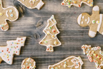 Gingerbread Christmas cookies on a wooden texture.