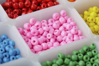 Close up multi colored beads heap in box