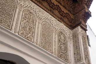Beautiful ornate relief at a facade of a madrasa in Fes, a Koran school, Morocco, Africa