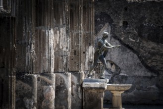 POMPEII, ITALY, MAY 04, 2022, Colonnade and sculptures of the Temple of Apollo near the Pompeian