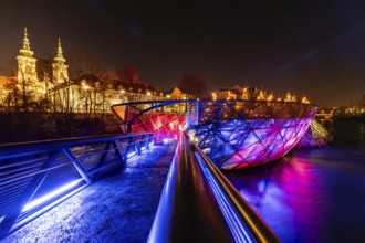 Illuminated Murinsel, Mariahilferkirche in the background, night shot, Graz, Styria, Austria,