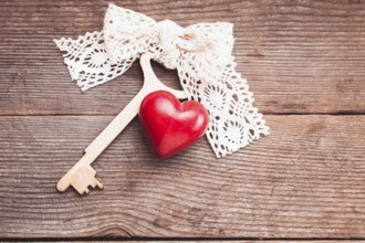 Old intage key and red heart. Key of my heart concept. Valentine's day greetings