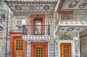 Traditional houses decorated with the famous geometric scratch patterns in the medieval mastic