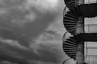 Spiral Staircase Against Sky with Storm Clouds in Switzerland.