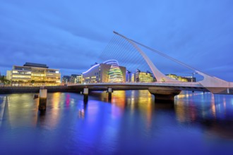 The River Liffey with the Samuel Beckett Bridge in Dublin, Ireland, at dusk, Europe