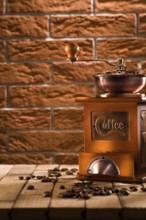 Wooden coffee grinder on table