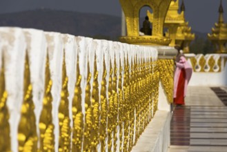 Nun on a gilded pagoda, Myanmar, Burma, Southeast Asia, Asia