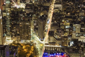 Cityscape of Manhattan with Flatiron Building at Night. New York City, United States of America.