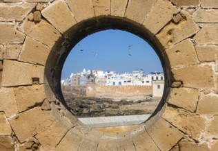 Famous view of medina Essaouira through a hole in the wall of the fortress, Morocco, Africa