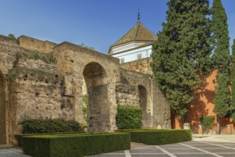 Courtyard at the entrance to Alcazar of Seville with wall from XI century, Spain, Europe