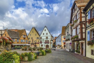 Main square with fountain with statue of pope Leo IX in Eguisheim, Alsace, France, Europe