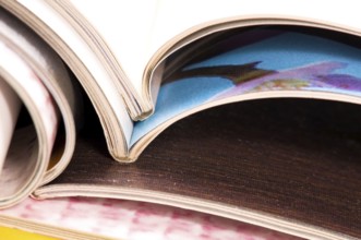 Stack of open magazines
