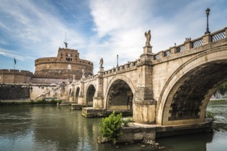 Rome, Italy, August 18, 2016: Bridge and Mausoleum Castel Sant Angelo at sunset. The Mausoleum of