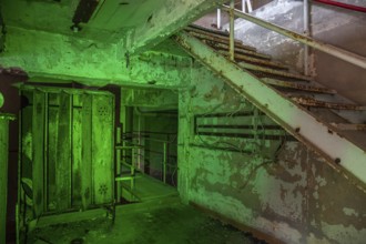 Old abandoned paper factory. Historic and typical factory building as a lost place. Destruction and