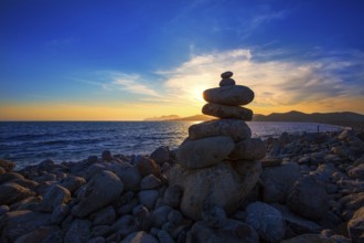 Ibiza Cap des Falco sunset with desire stones at the beach in Sant Josep Balearic Islands