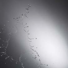 Water drop splash with grey background