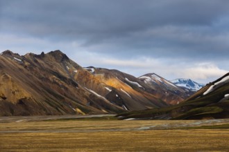 Mountains and hills with blotches of snow in Landmannalaugar, Iceland, Europe