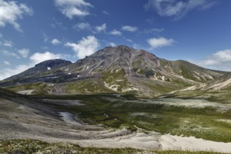 Summer mountain landscape of Kamchatka Peninsula: beautiful view of cone Khangar Volcano on sunny