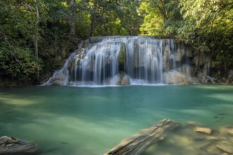 Erawan Waterfall with fish in water in Kanchanaburi Province, Thailand, Asia