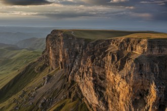 Aerial panorama view of plateau Bermamyt and hills at sunset, North Caucasus mountains, Russia,