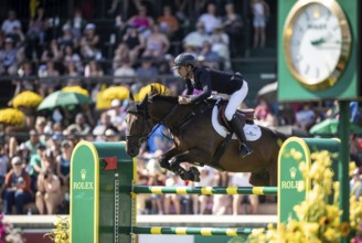 Steve Guerdat of Switzerland and riding Venard de Cerisy compete in the first round of the 1.60m