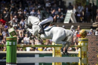 Hilary Scott of Australia and riding Oaks Milky Way compete in the first round of the 1.60m CPKC