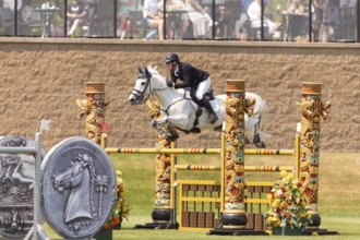 Daniel Coyle of Ireland and riding Incredible, compete in the 1.60m Grand Prix during The