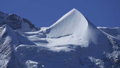 Snow covered pointed peak of Mount Silberhorn, Switzerland, Europe