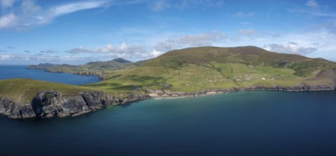 Landscape view of the turquoise waters and golden sand beach at Slea Head on the Dingle Peninsula
